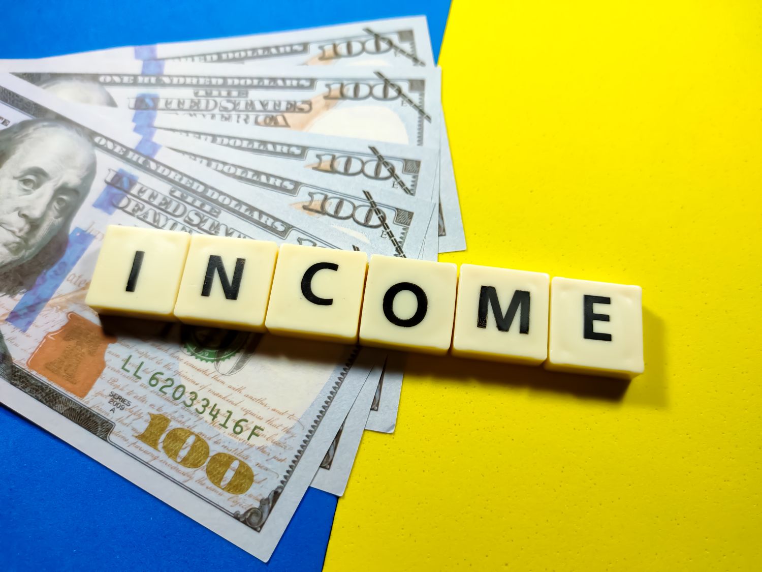 bank notes next to income